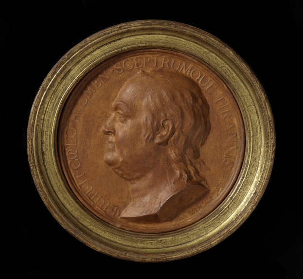 Bronze-Medaille mit einem goldenen Rahmen und einem Relief von Thomas Jefferson.