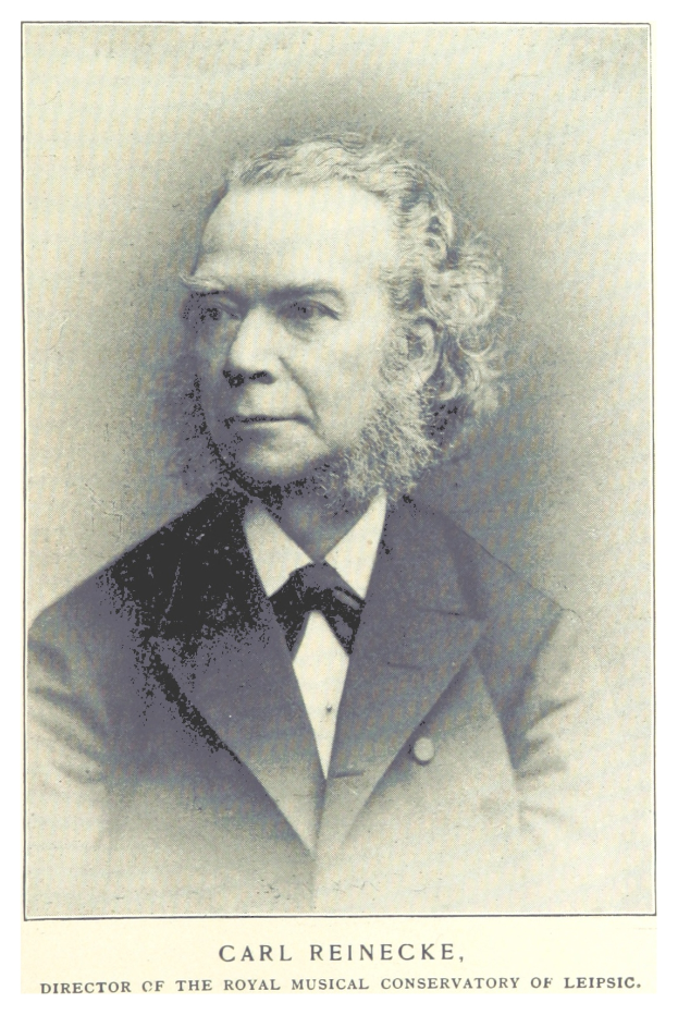 Ein Schwarz-Weiß-Foto von Carl Reinecke, dem Direktor des Königlichen Musik-Konservatoriums Leipzig, der einen Anzug trägt, mit Text unten auf dem Bild.